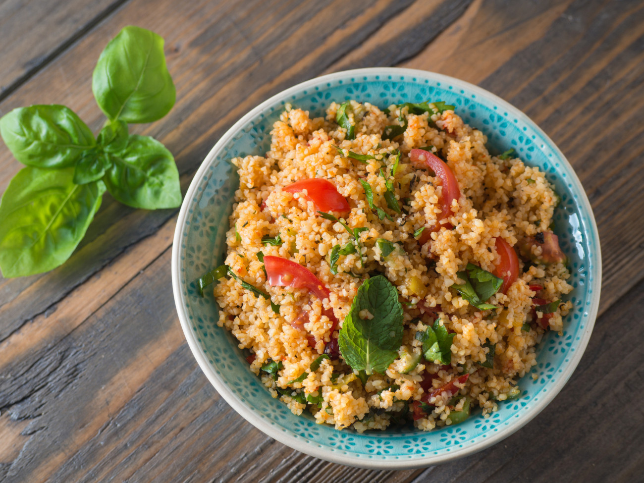 Arabic traditional cuisine - Couscous with tomato and basil from the top
